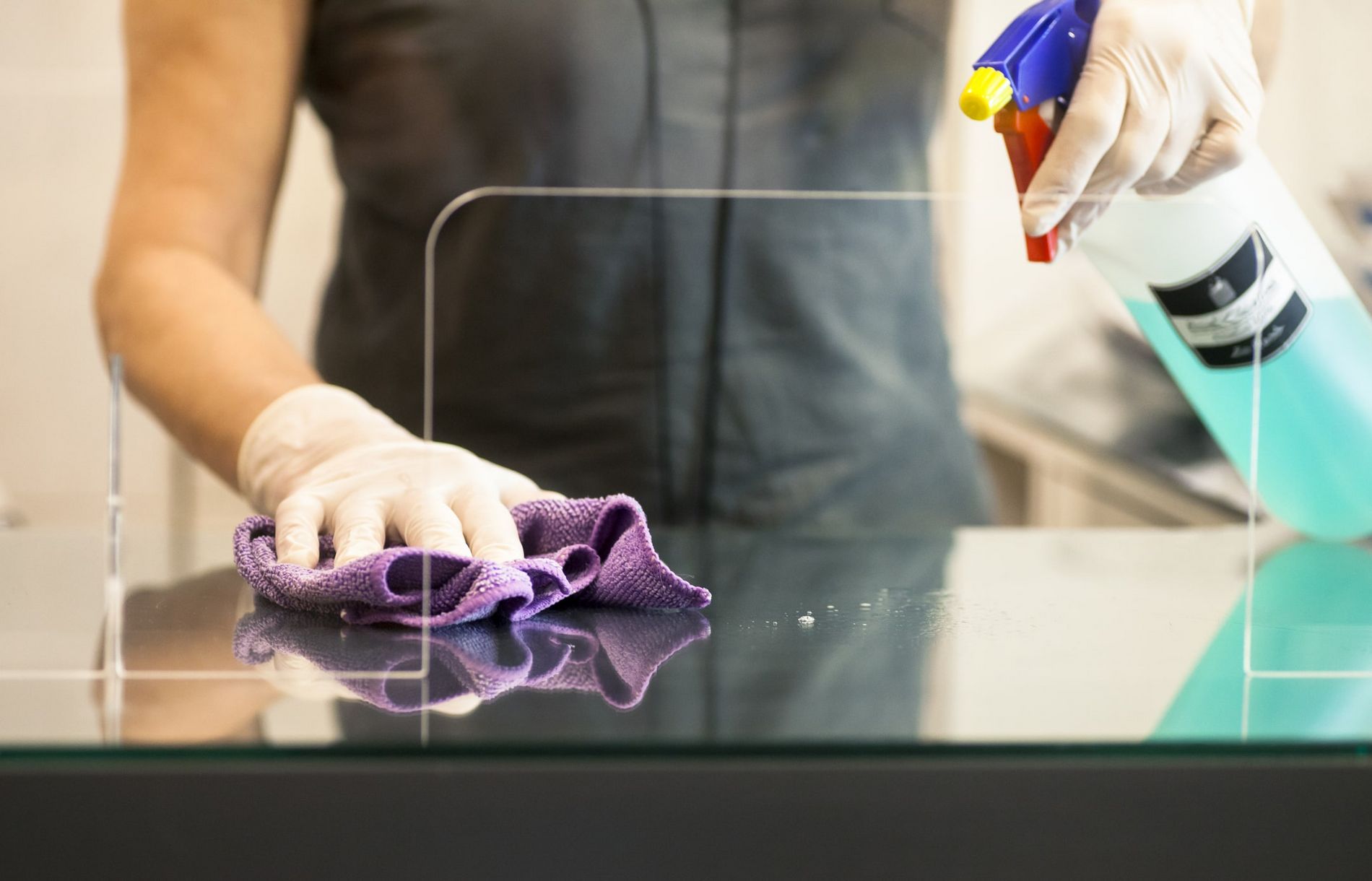 woman cleaning glass