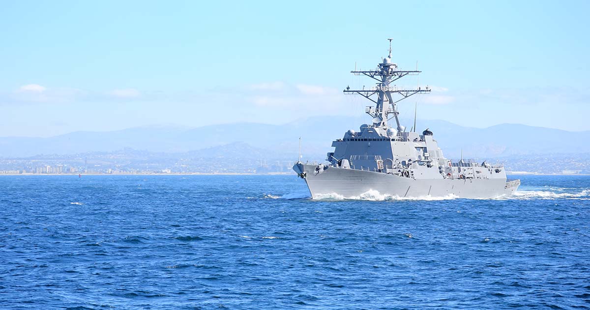 A powder coating ship sailing in the sea under clear blue sky